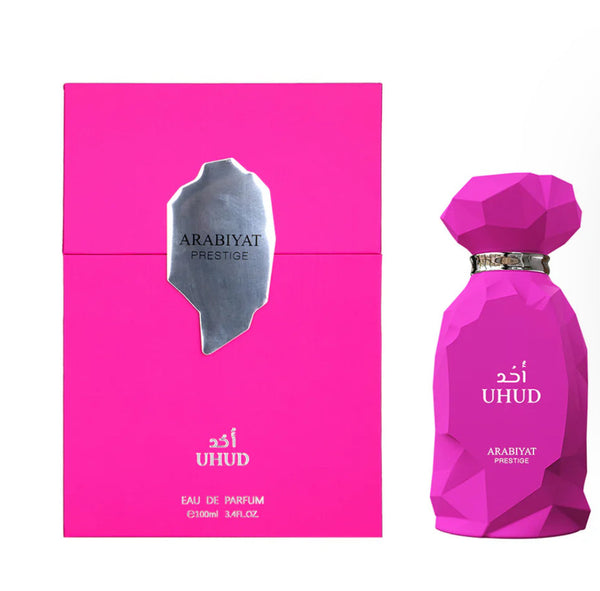 Pink Arabiyat Prestige perfume bottle and packaging on a white background
