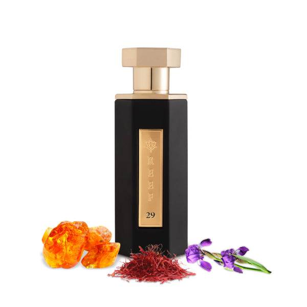 REEF 29 By Reef Perfumes EDP 100ml in a sleek black and gold bottle, surrounded by amber, saffron, and floral notes for a warm, spicy scent.