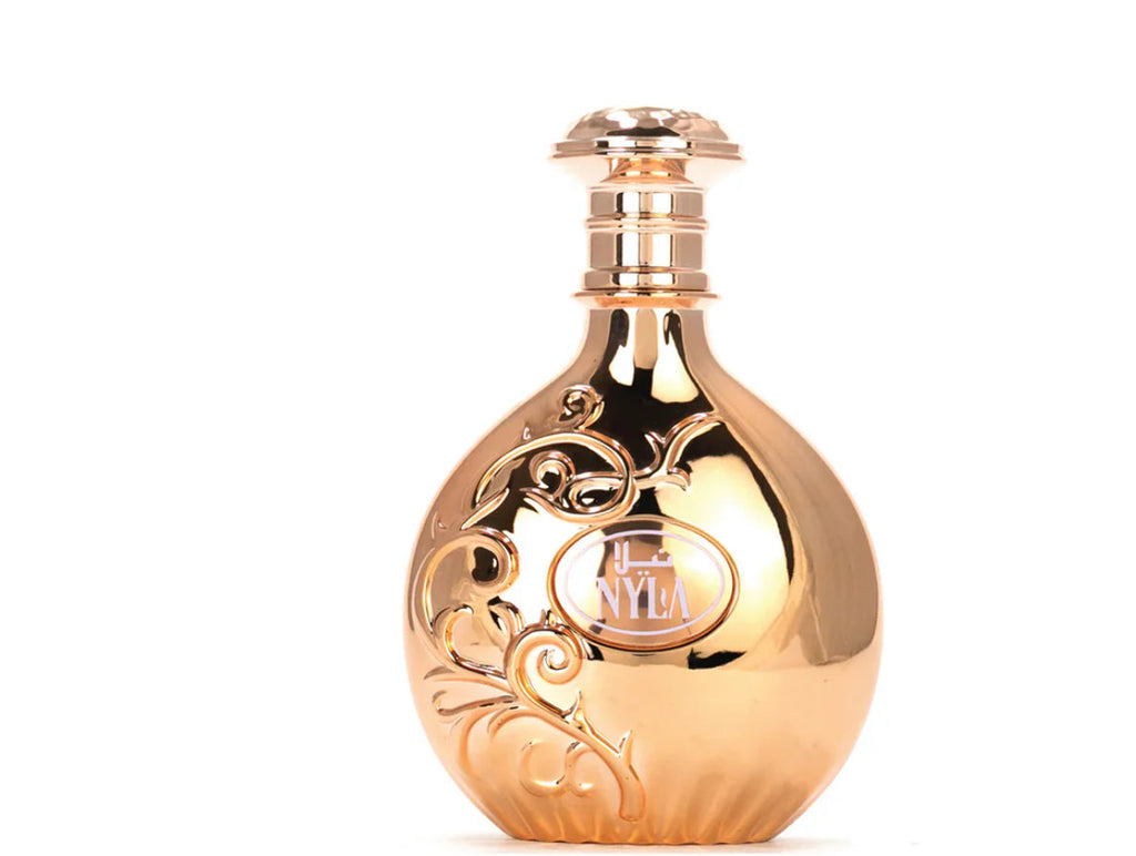 Gold perfume bottle with intricate designs on a white background