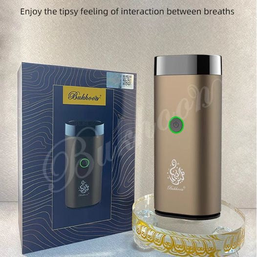 Portable Electric Rechargeable Bakhoor Burner in gold shown with packaging, ideal for gifting and luxury home fragrance use.