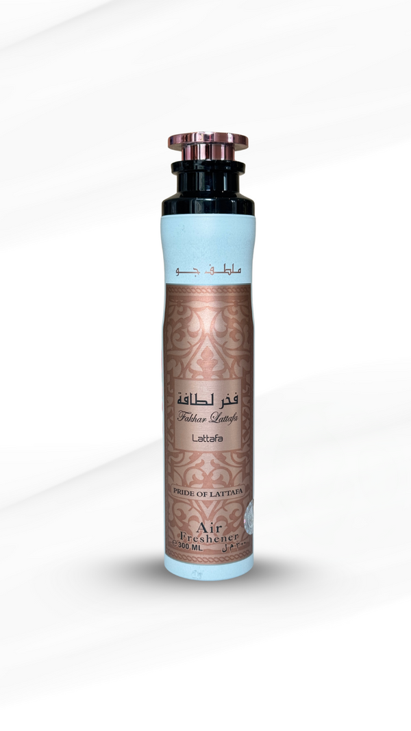 Lattafa Fakhar Air Freshener 300ml in a sleek metallic rose gold and white canister, ideal for adding a sweet, musky floral scent to home interiors.
