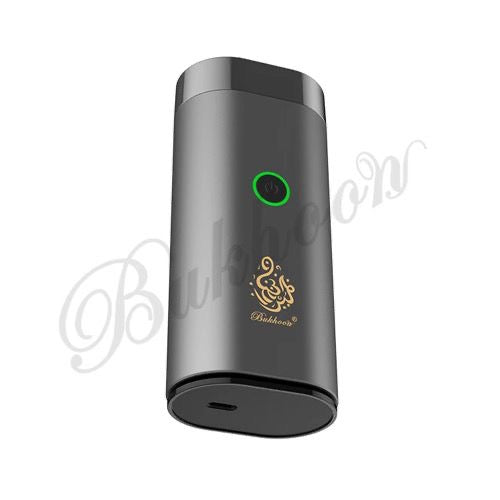 Portable Electric Rechargeable Bakhoor Burner in gold and black with sleek design and USB charging port, ideal for home fragrance diffusion.