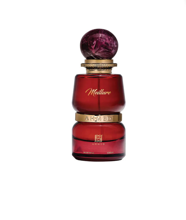 Red perfume bottle with gold accents on a white background