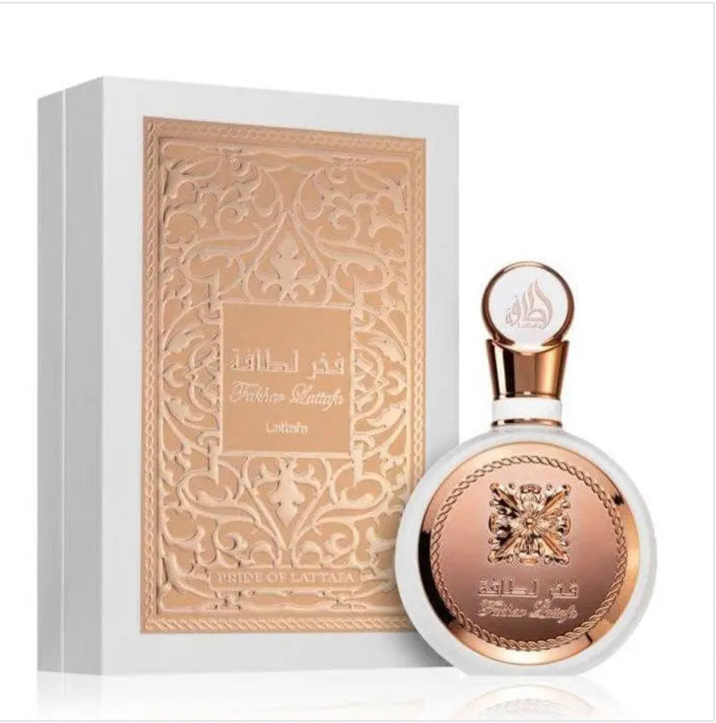 Fakhar Rose Gold perfume box with intricate design and white background