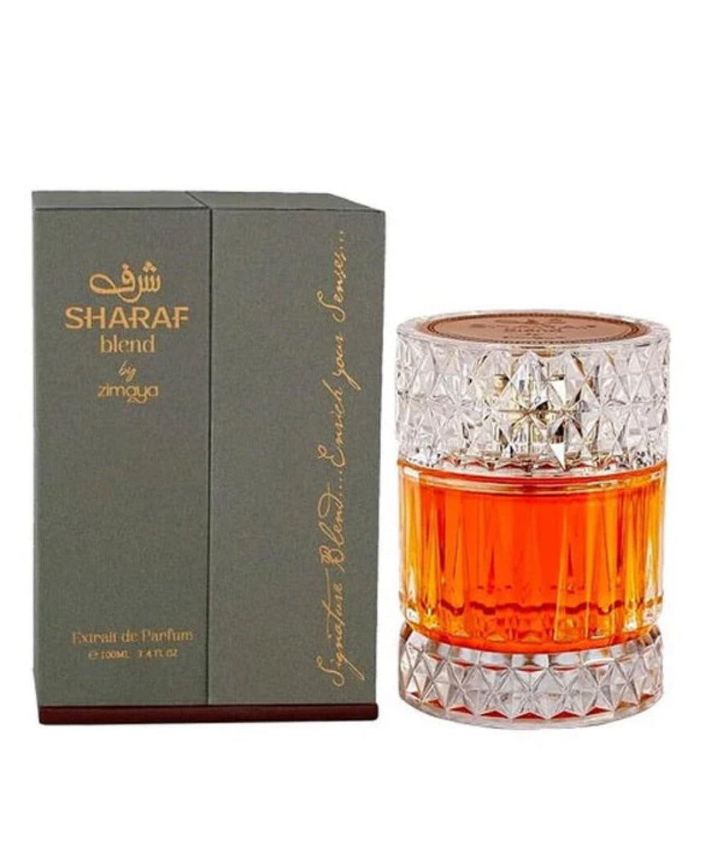 SHARAF Blend by Zimaya 100ml EDP perfume in a crystal-cut glass bottle with amber liquid, displayed next to its elegant grey box packaging.