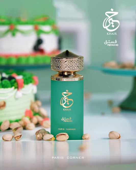 Khair Pistachio by Paris Corner 100ml EDP displayed with pistachios and cakes, highlighting its sweet, nutty, and creamy gourmand scent profile.