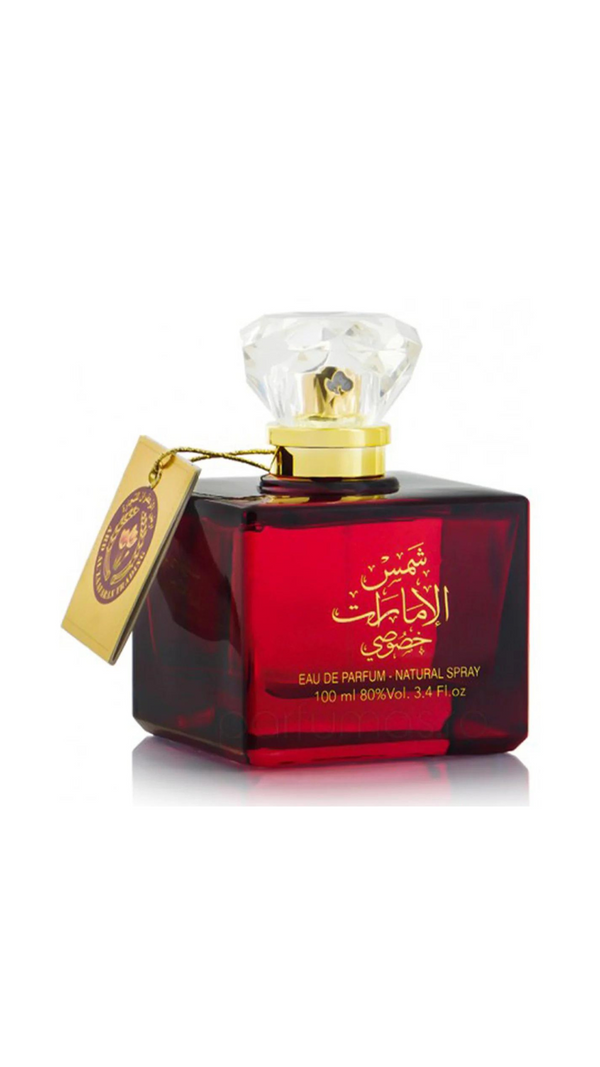 Red perfume bottle with gold accents, crystal cap, Arabic script, luxury fragrance