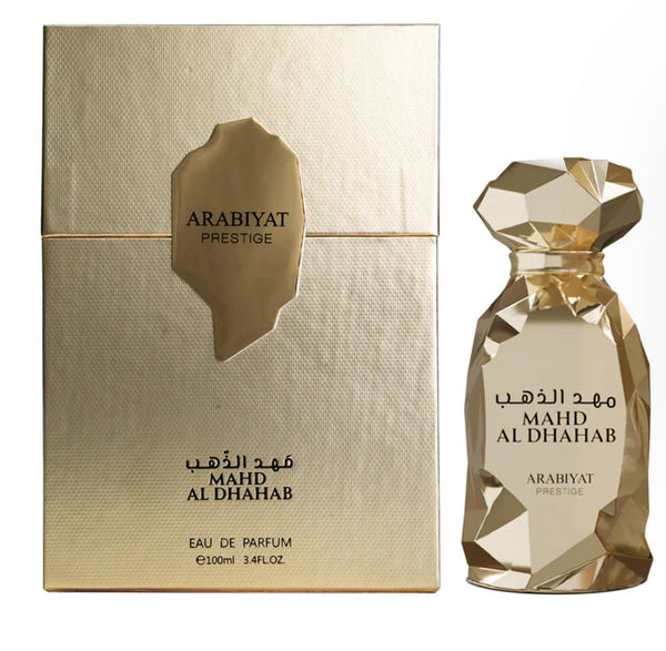 Gold Arabiyat Prestige perfume bottle and packaging on a white background