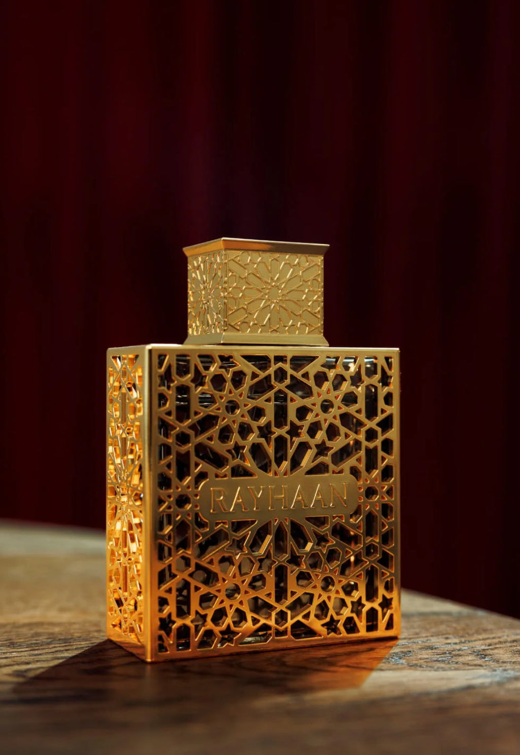 Gold decorative box with intricate patterns on a dark background