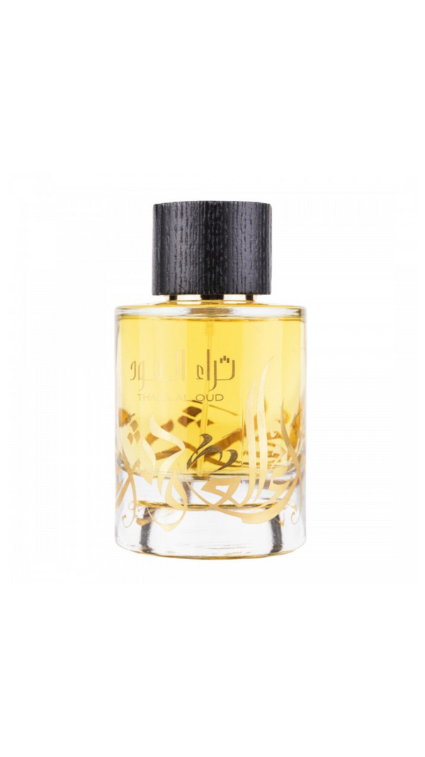 Thara Al Oud perfume bottle with black cap, gold Arabic calligraphy, and yellow liquid, elegant fragrance