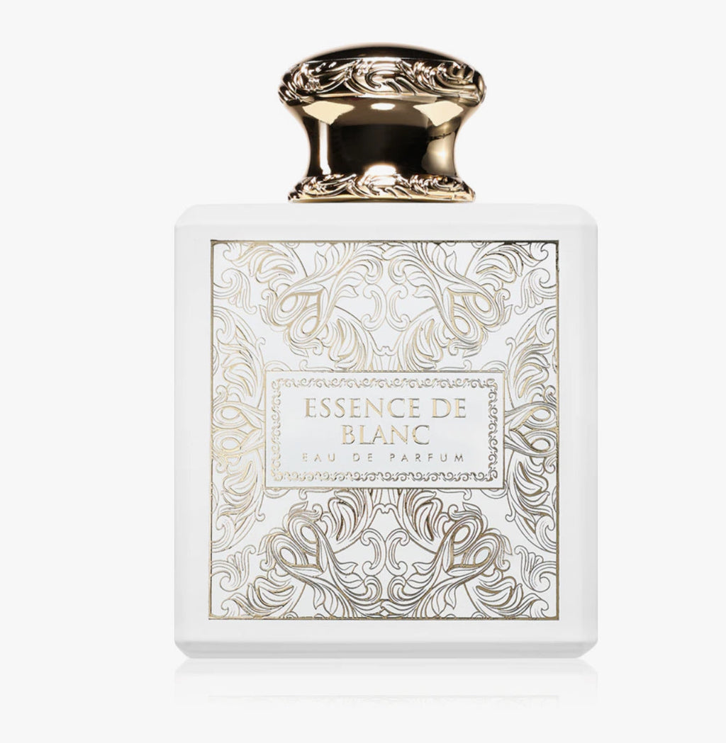 Perfume bottle labeled 'Essence de Blanc' with intricate design on a white background
