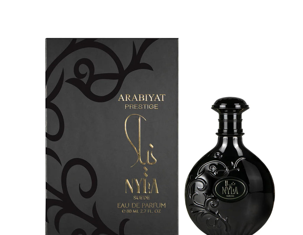 Black perfume bottle and packaging with 'Arabiyat Prestige' branding on a white background
