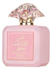 Pink perfume bottle with decorative cap on a white background
