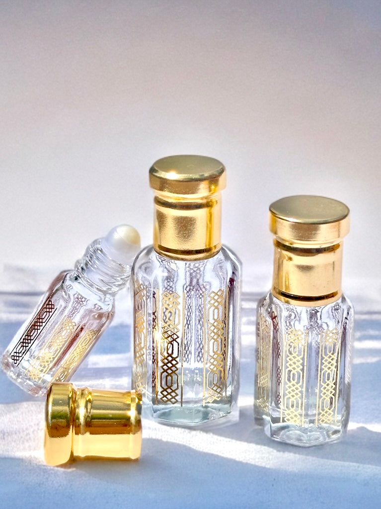 Perfume oil bottles with gold caps
