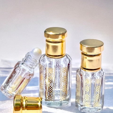 Perfume oil bottles with gold caps