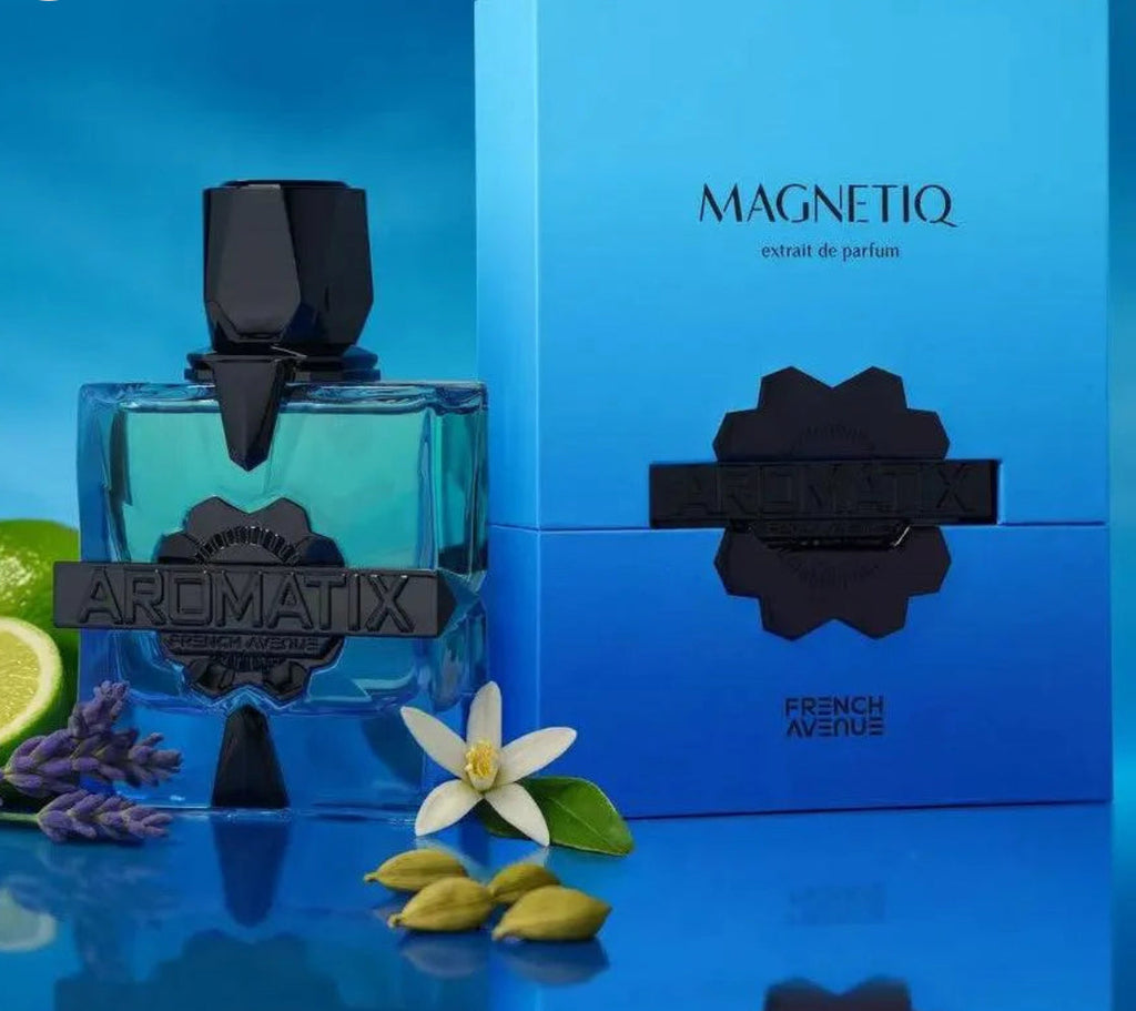Aromatix Magnetiq perfume bottle and packaging on a blue background with flowers and leaves.