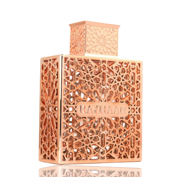 Rose gold perfume bottle with intricate patterns and 'RAYHAAN' branding on a white background