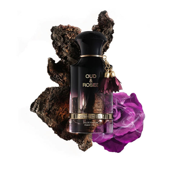 Perfume bottle labeled 'Oud & Rosee' with purple flower and dark rock background