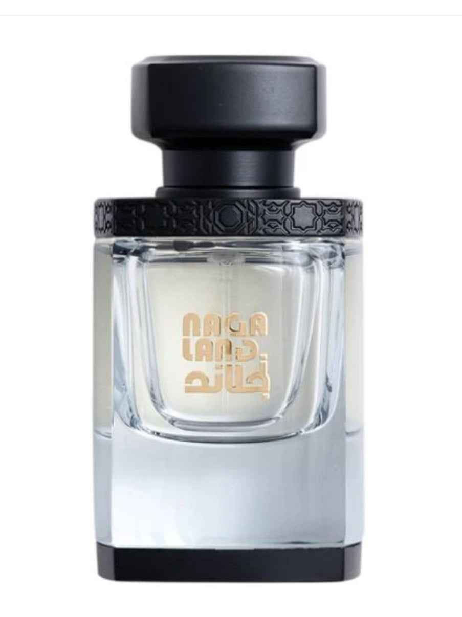Nagaland Perfume -50 Ml by Al Majed Oud in a clear glass bottle with black cap, showcasing elegant Arabic and English branding.