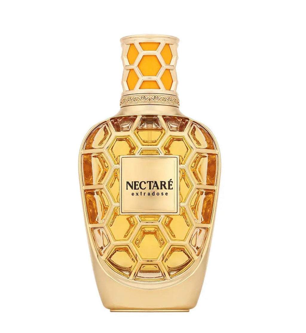 Gold perfume bottle with honeycomb design on a white background