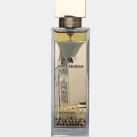 Essence of Casablanca EDP 100ml by Swiss Arabian in a tall, elegant glass bottle with gold accents and oriental architectural design.