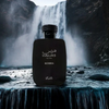 Black perfume bottle labeled 'Hawas Kobra' in front of a waterfall