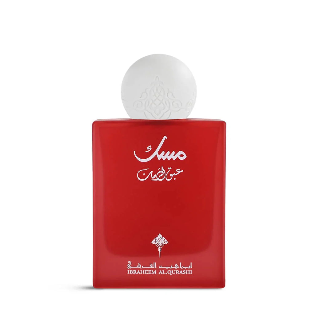 Red perfume bottle with white cap on a white background