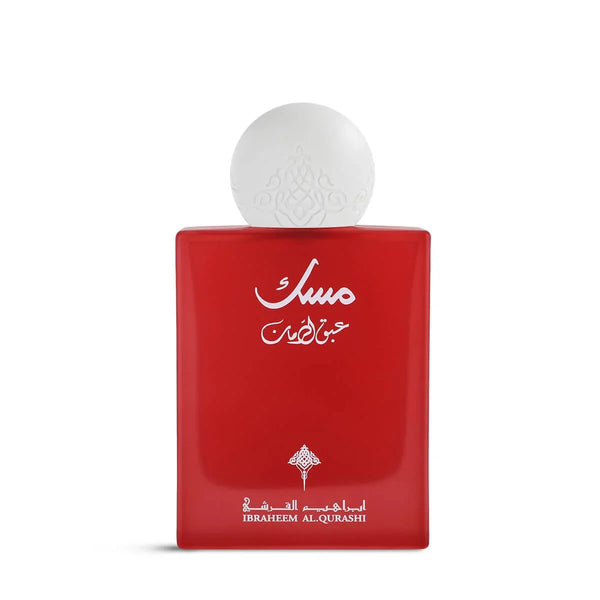 Red perfume bottle with white cap on a white background