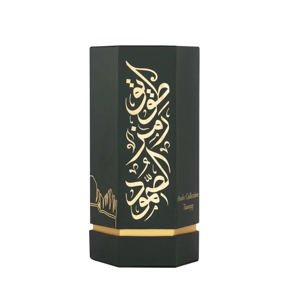 Luxury packaging of REEF Arabs of Tuwayq 100ml EDP featuring elegant gold Arabic script on a black hexagonal box, perfect for fruity and sweet fragrance fans.