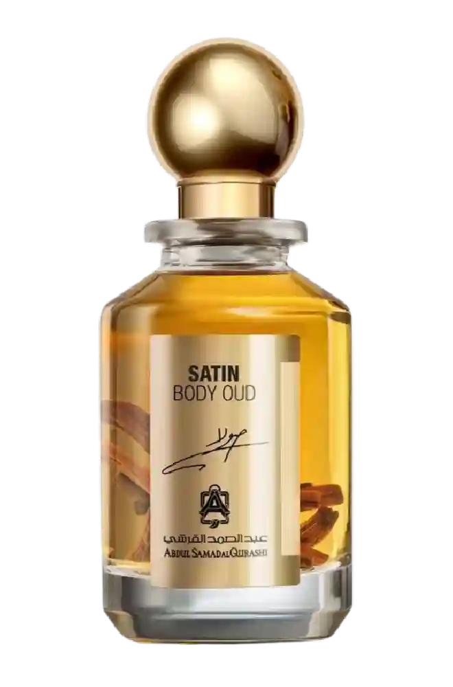 AbdulSamad AlQuraishi Satin Body Oud perfume in a clear glass bottle with gold cap, showcasing luxurious woody and spicy fragrance notes.