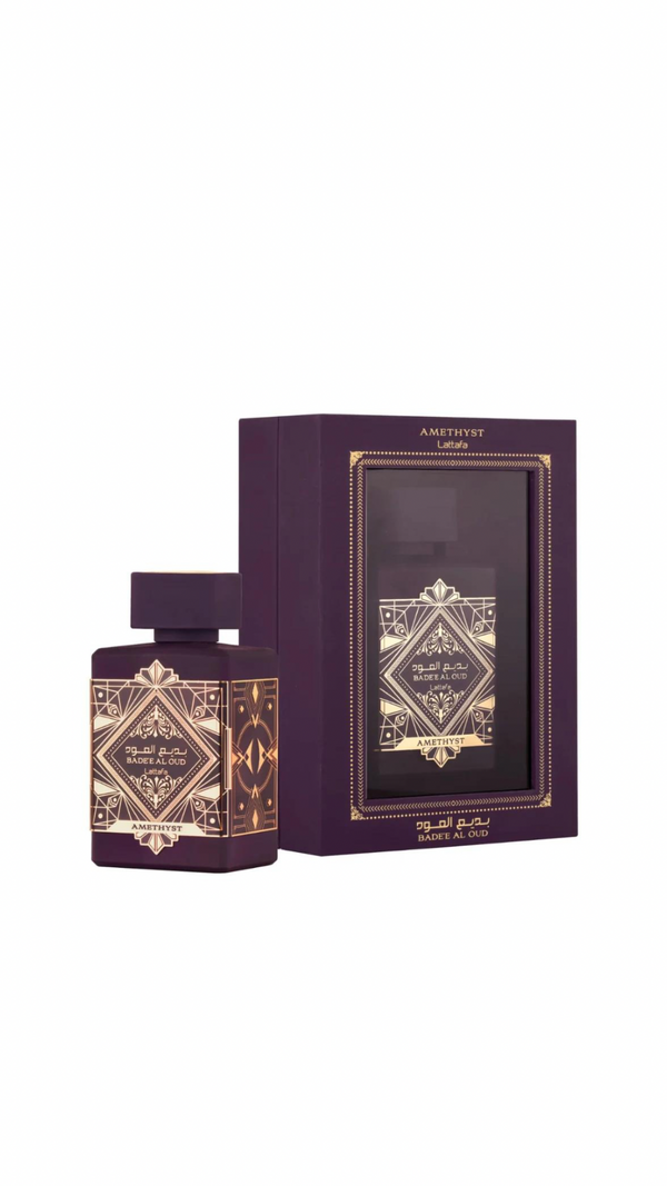 Purple perfume bottle with gold geometric design and packaging, luxury fragrance gift set