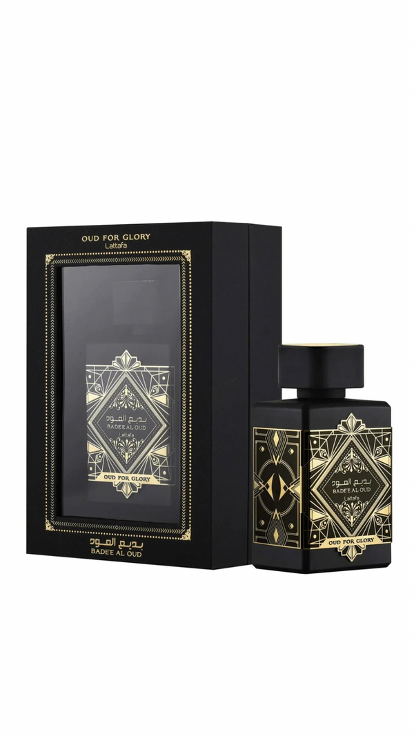 Gift box packaging for Bade’e Al Oud perfume with black and gold decorative design, luxury fragrance gift set