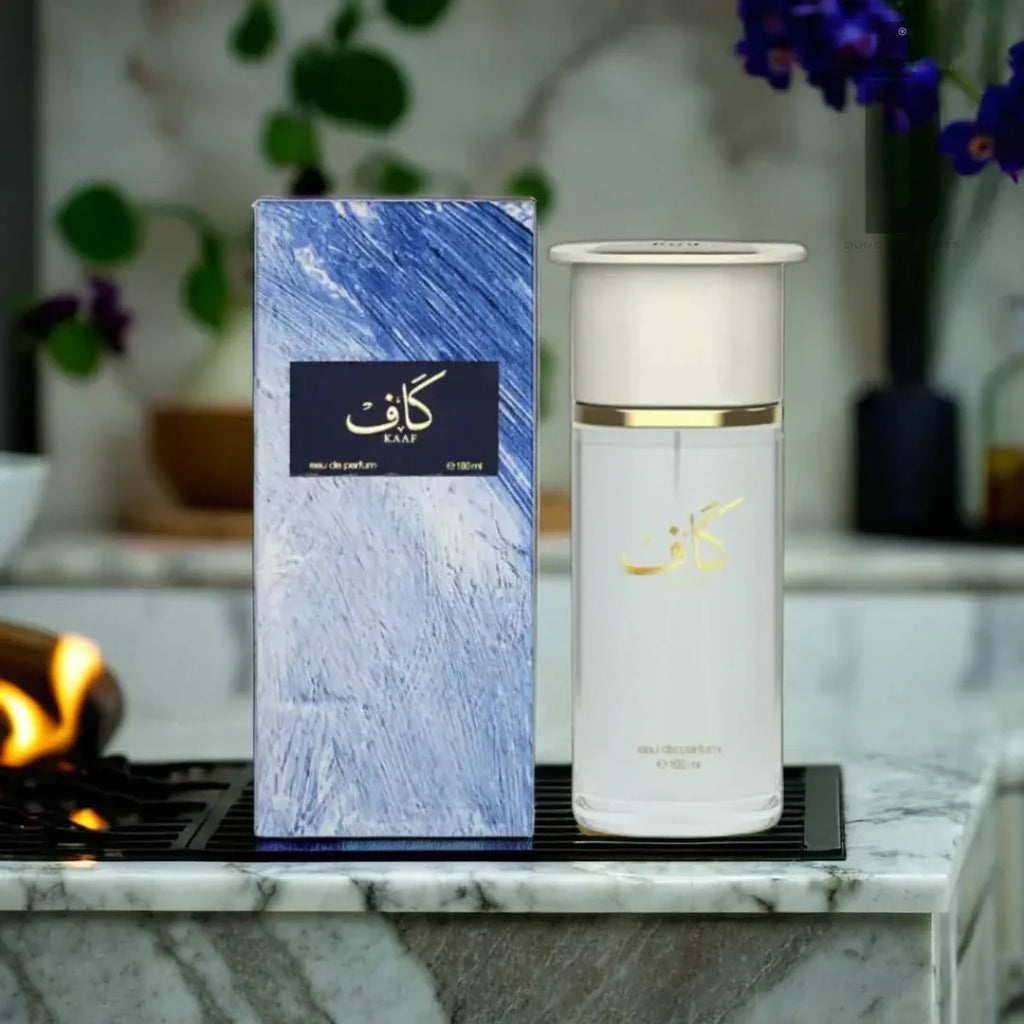 Khaif perfume bottle and packaging on a marble surface with decorative elements.