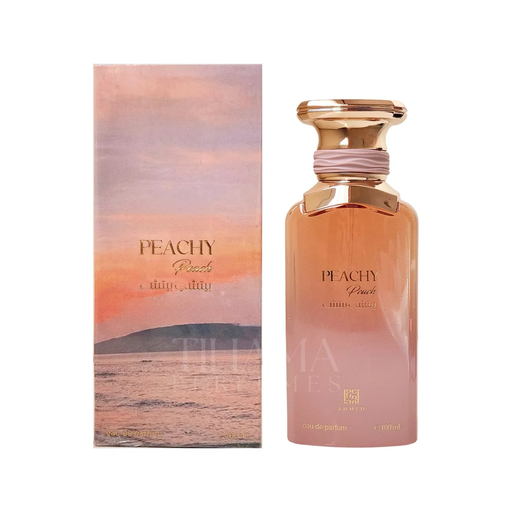 Peachy perfume bottle and packaging with a scenic design on a white background