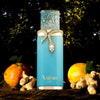 Vulcan Feu by French Avenue 100ml Eau de Parfum bottle in turquoise with gold snake design, placed among ginger roots and pomegranates in a forest setting.